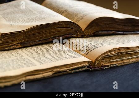 Jewish Bible. An open old Jewish books. Opened scripture pages. Selective focus. Closeup of hebrew text Stock Photo