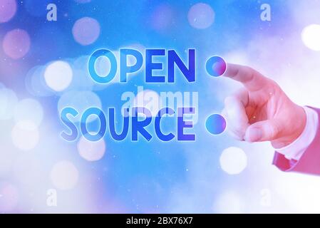 Writing note showing Open Source. Business concept for contains the source code that can be modified and enhanced Stock Photo