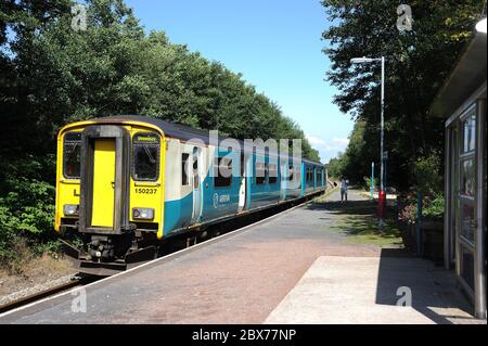 150237 at Pontarddulais station with a train for Shrewsbury. Stock Photo