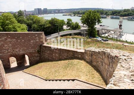 Belgrade, Serbia - May 21, 2020: People walking on a recently build pedestrian bridge that connects Kalemegdan fortress with promenade on the river Sa Stock Photo