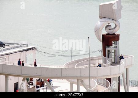 Belgrade, Serbia - May 21, 2020: People walking on pedestrian bridge, that connects Kalemegdan with promenade on the river Sava, with the elevator wit Stock Photo