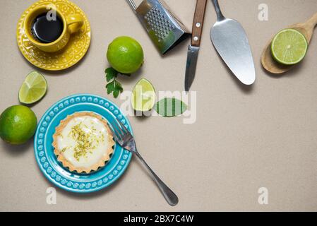 Top view of delicious lemon tart. Food concept Homemade organic Lemon, lime tarts or mini pie on a wooden board. Copy space. Selective focus. Stock Photo