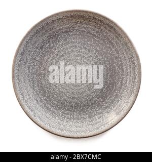 Round gray stoneware plate, empty.  Top view, isolated on white. Stock Photo