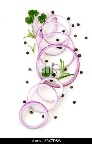 Food background red onion slices, peppercorns and herbs, top view isolated on white Stock Photo