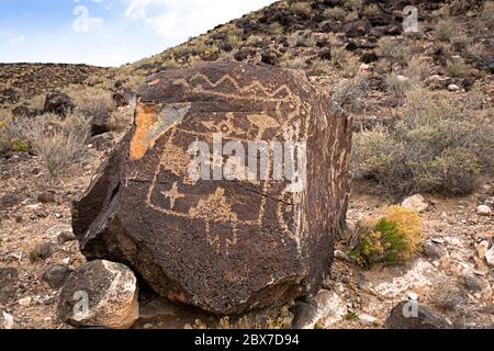 NM00526-00...NEW MEXICO - Geometeric shapes pecked into the basaltic rock by Ancestral Puebloans in the Boca Negra Canyon area  Petroglyph NM. Stock Photo