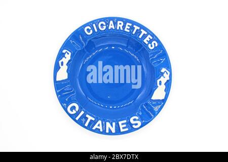 Ceramic ashtray with Gitanes, isolated on a white background, close up Stock Photo