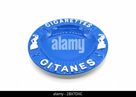 Ceramic ashtray with Gitanes, isolated on a white background, close up Stock Photo