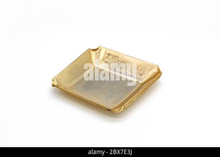 Vintage metal ashtray with logo of Cinzano italian vermouth, isolated on a white background Stock Photo