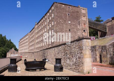 New Lanark Mill Village, World Heritage Site. Photo Showing Mill 3 at Front, Adjacent Mill 4 at Back and Connecting Bridge to Institute Building. Stock Photo