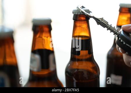 Opening a beer during coronavirus quarantine Stock Photo