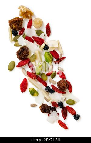 Raw organic paleo trail mix, scattered.  Isolated on white, top view. Stock Photo