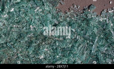 background of transparent green tempered triplex winshield  glass broke into small pieces due to car crash Stock Photo