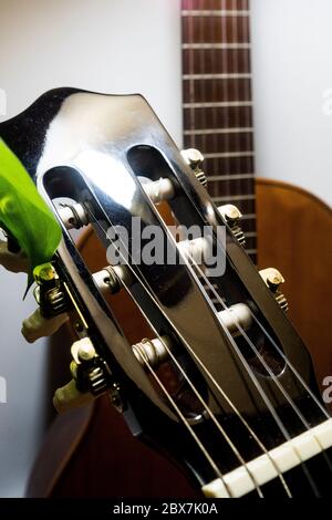 A guitar waiting for the musician Stock Photo