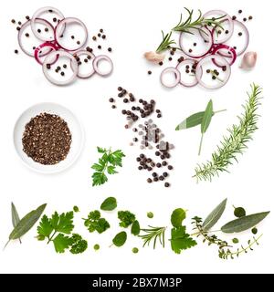 Food background collection with onions, herbs, and peppercorns, all isolated on white.  Overhead view. Stock Photo