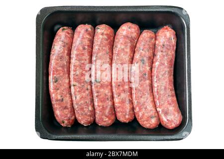 Raw sausages on styrofoam tray, isolated on white. Stock Photo