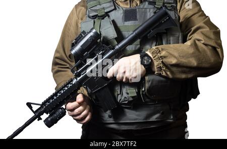 Isolated closeup photo of a fully equipped military soldier standing with rifle view. Stock Photo