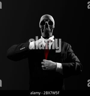 Black and white politician man with skull head in black suit straightens a red tie on black background. Stock Photo