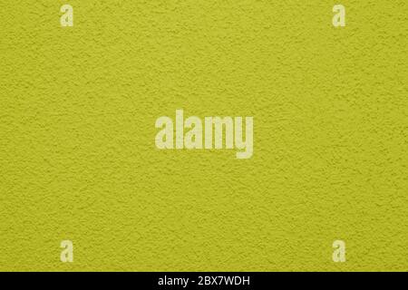 Bright, colorful concrete wall texture, painted background - yellow color. Wallpaper plaster. Stock Photo