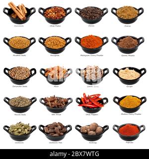 Lots of spices in small black dishes, with names beneath.  XXXL file. Stock Photo