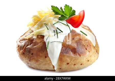 Baked potato filled with sour cream, grated cheese, and tomato.  Garnished with chives and parsley, isolated on white. Stock Photo