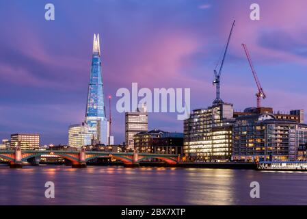 Colorful Sunset View in London With Southwark Bridge and the Shard Stock Photo