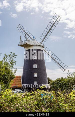 Burnham Overy Staithe, Norfolk, England, April 23, 2019: Tower Windmill (dating from 1816. It is now used as self-catering accommodation. Stock Photo