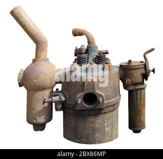 The exhaust pipes  of an old rusty vintage tractor looks like a space gun. Isolated on white Stock Photo