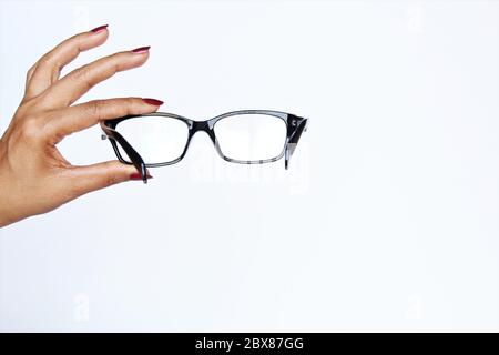 Woman hand showing sign glasses. photo isolate on white front view copy space Stock Photo