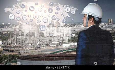 Industrial 4.0 concept.double exposure businessman and icons big data connection manufacturing technology of oil and gas refining industrial. Stock Photo