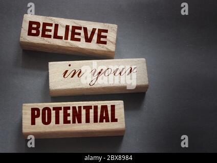 Believe in Your Potential word written on wooden blocks. Motivation for achievements in business or career concept Stock Photo