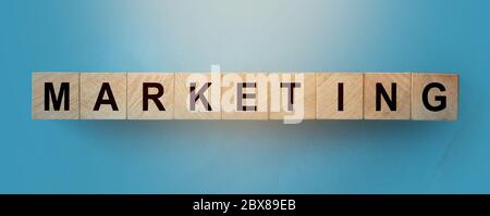 Marketing word written on wood block. Business promotion and brand desing concept
