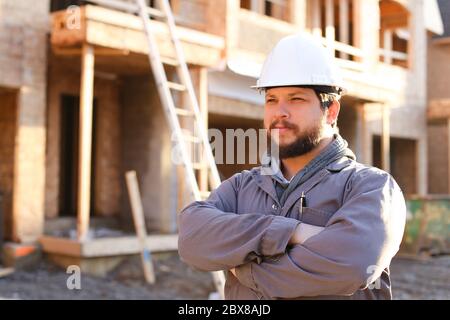 Portrait of construction architect and builder wearing hardhat. Stock Photo