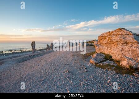 Sunset at Langhammars on Fårö island in the Baltic sea. Langhammars is famous for its collection of limestone sea stacks. Stock Photo