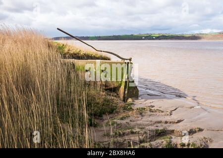 Purton Hulks are abandoned boats deliberately beached beside the River Severn to reinforce the river banks.  Purton, Gloucestershire, England, UK. Stock Photo