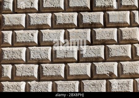 Ashlar (Bugnato in Italian), closeup of a wall made of big blocks of stones in Trento city, Trentino Alto Adige, Italy, Europe Stock Photo