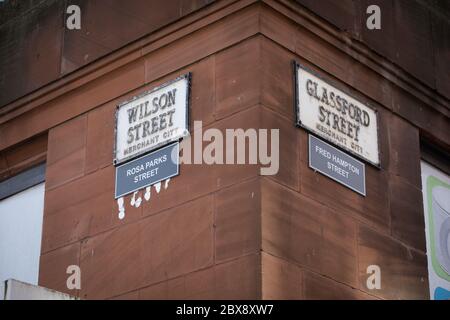 Glasgow, UK, 6th June 2020. Activists of the Celtic FC Green Brigade (ultra-fans) have renamed streets in the Merchant City which commemorate the historical fathers of the city, who had connections with plantations and slavery, with the names of black civil rights activists and slaves, in a protest aimed at drawing attention to Glasgow's connections to slavery. Glassford Street, named after 18th century tobacco lord John Glassford, renamed Fred Hampton Street after the American activist and revolutionary socialist, and Wilson Street, named after 18th century tobacco lord James Wilson, renamed Stock Photo