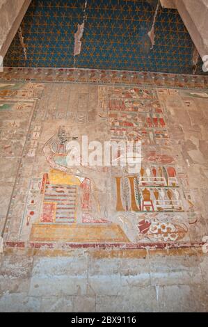 Hieroglypic carvings and paintings on interior wall at the ancient egyptian temple of hatshepsut in Luxor Stock Photo