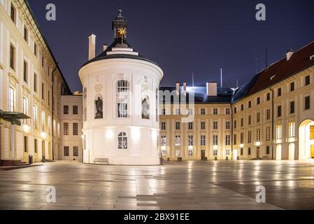 Medieval houses and old drinking fountain in Golden Lane by night, Prague Castle, Czech Republic. Stock Photo