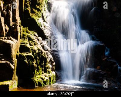 Kamienczyk waterfall near SzklarskaPoreba in Giant mountains or Karkonosze, Poland. Long time exposure. Stock Photo