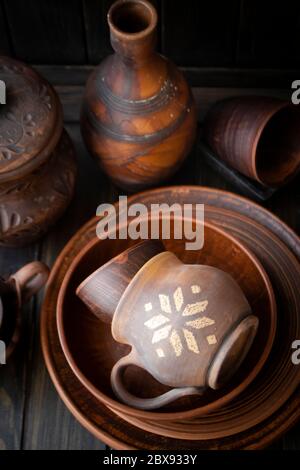 Collection of ceramic pottery, local craft products from Belarus. Rustic ceramic plates and cups. Traditional pattern Stock Photo