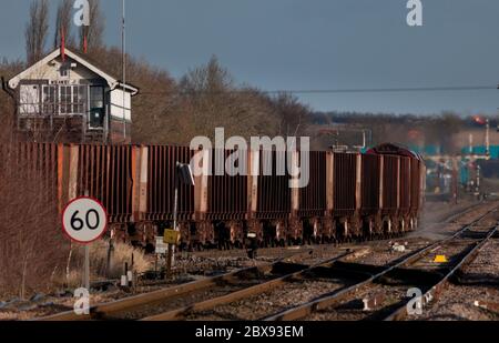 Freight train of empty iron ore tippler bogie wagons passing Wrawby Junction, Barnetby (Lincs) Stock Photo