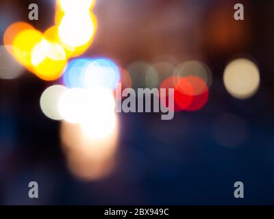 Night traffic city lights. Abstract unfocused image with bokeh. Stock Photo
