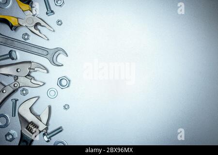 various renovation instruments and working tools on grey metal background Stock Photo