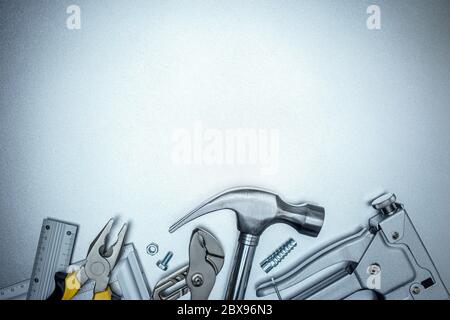 working hand tools for construction and house renovation on grey background. top view Stock Photo
