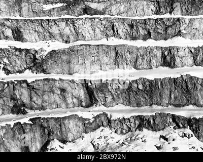 Old mountain stone quarry in Tirol Alps near Fieberbrunn, Austria, Europe. Black and white image. Stock Photo