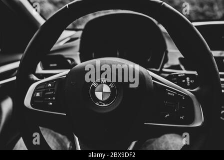 Russia Sochi Krasnaya Polyana June 4, 2020. black and white photo steering wheel BMW Stock Photo