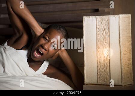 Shouting, headache and elderly woman in bed with insomnia, vertigo or  menopause in her home. Scream Stock Photo by YuriArcursPeopleimages