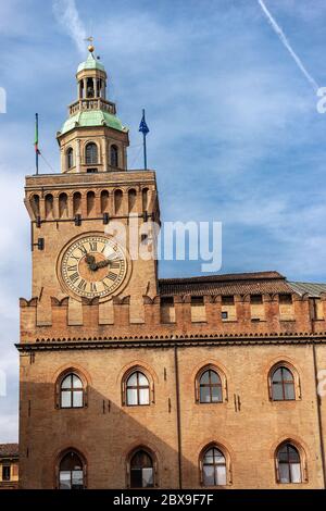 Torre degli Accursi and Palazzo d'Accursio. Clock tower and Town hall in downtown of Bologna (XIII century), Piazza Maggiore, Emilia-Romagna, Italy. Stock Photo