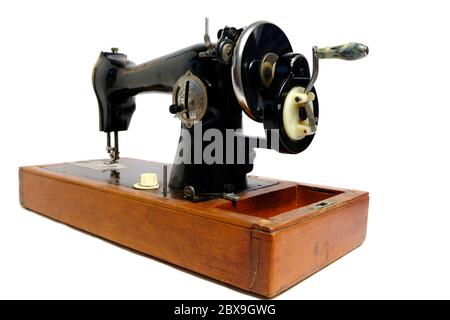Old, retro vintage sewing machine on a white background Stock Photo