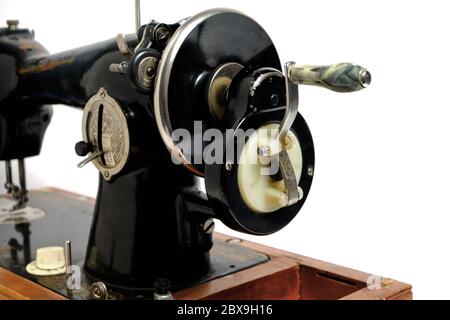 Old, retro vintage sewing machine on a white background Stock Photo